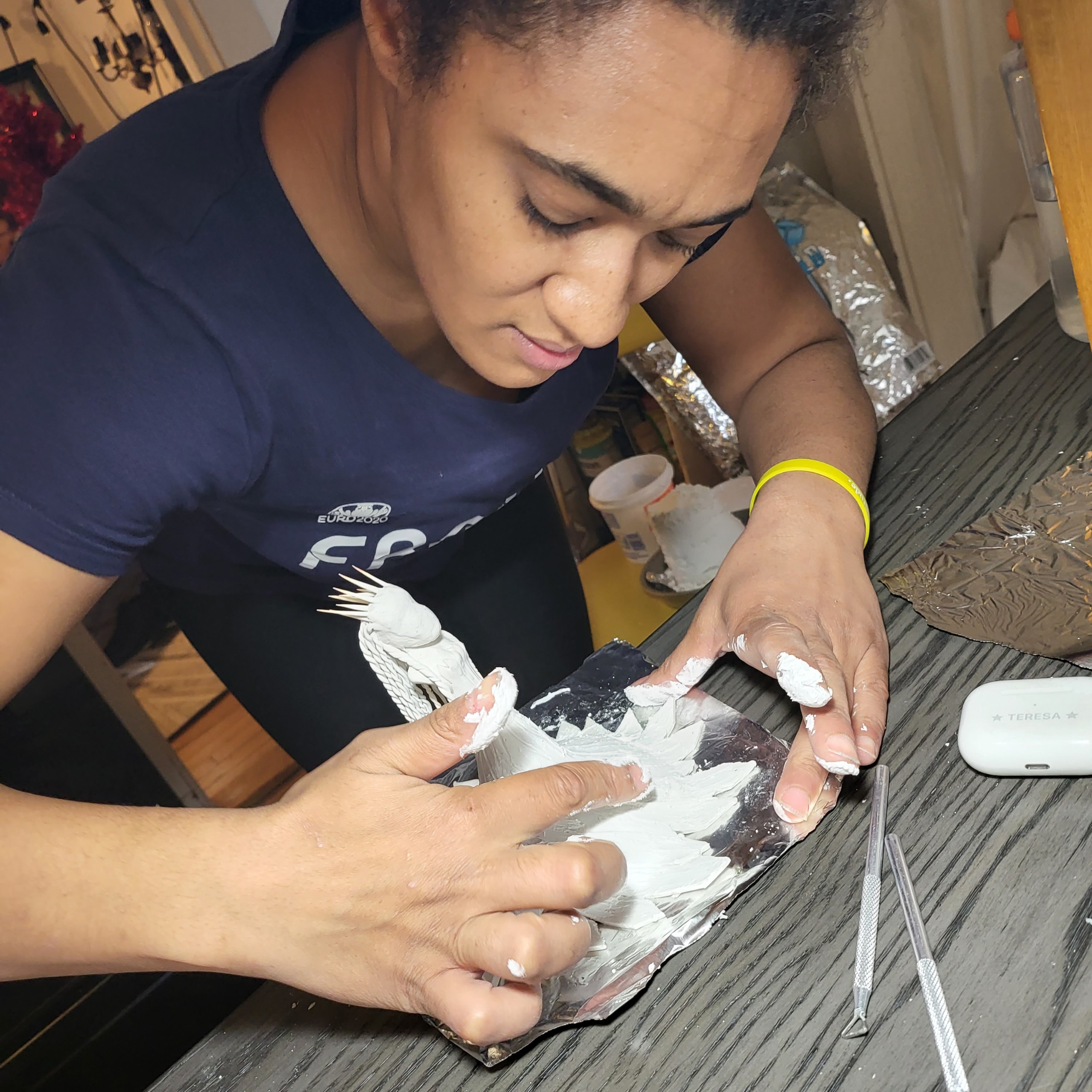 Teresa working on a sculpture